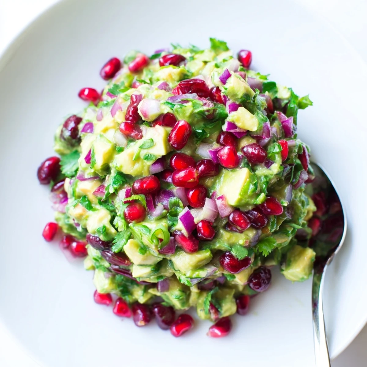 Creamy avocado mixed with sweet cranberries in flavorful jalapeño salsa dip.