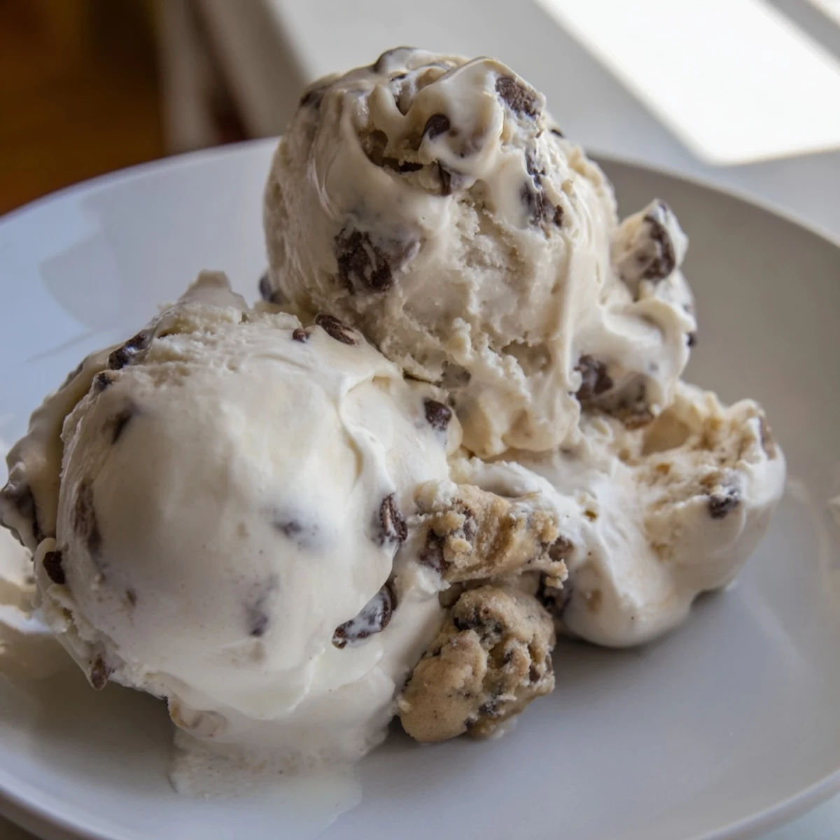 Indulgent cottage cheese ice cream swirled with chewy cookie dough bites.  
