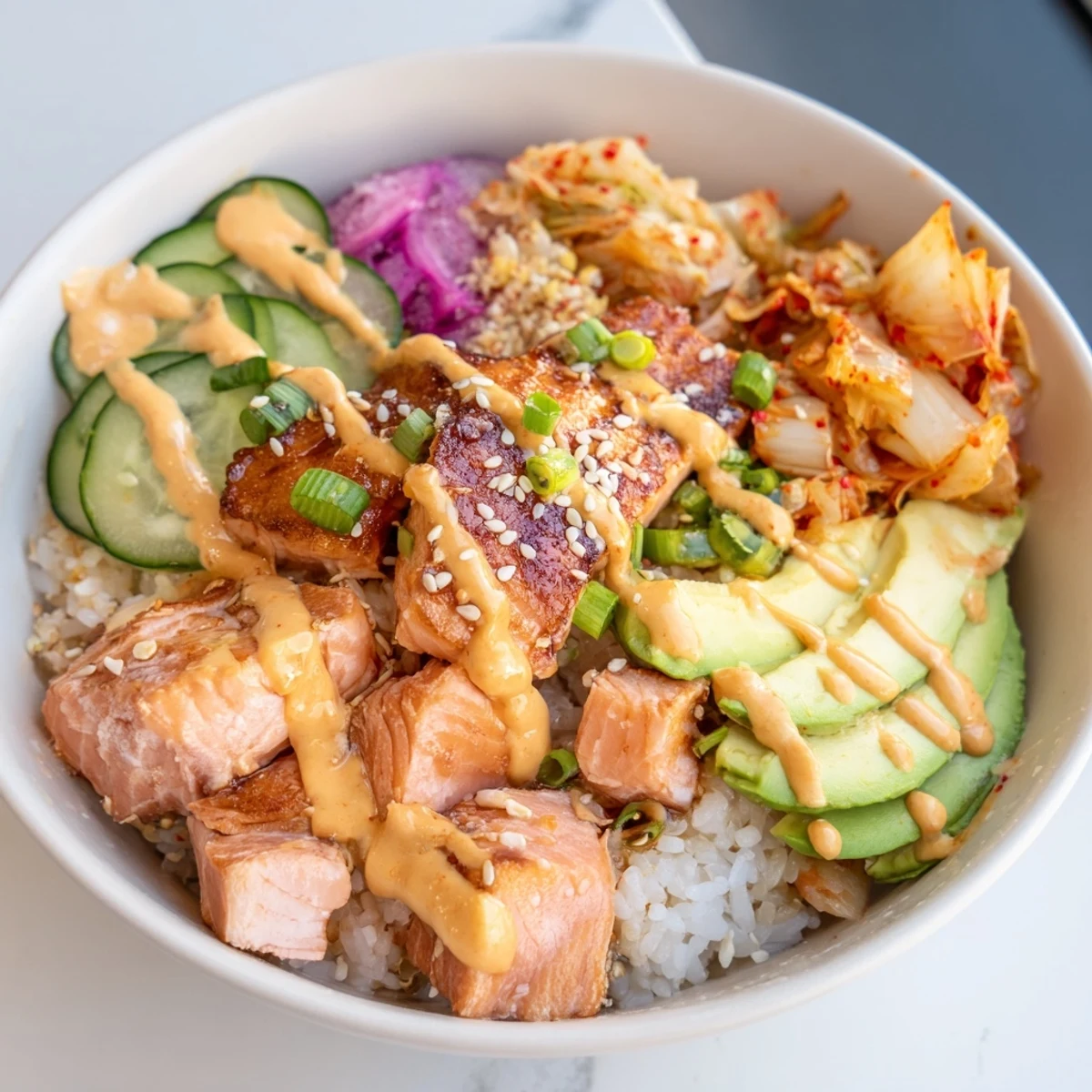 A vibrant Crispy Salmon Rice Bowl with golden rice, fresh veggies, and savory toppings.