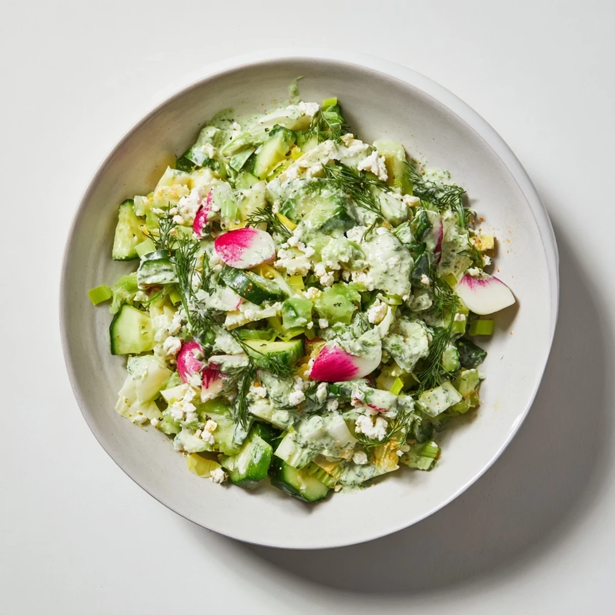 A colorful bowl of Green Goddess Cabbage Dip, a healthy vegetarian appetizer, looks absolutely delicious.