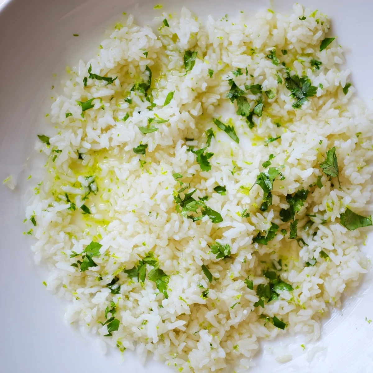 Steaming bowl of Cilantro Lime Rice: fluffy, bright green, a zesty Mexican side dish.