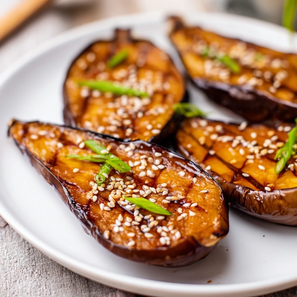 Savory Miso Glazed Eggplant served warm over fluffy white rice, highlighting its tender, roasted texture and rich umami flavor profile.