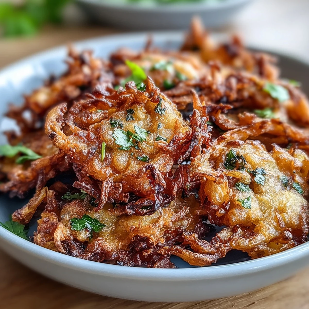 Crispy onion fritters made with gram flour and fragrant spices, air-fried to golden perfection for a guilt-free treat.  
