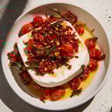 Golden baked feta 2.0 with sweet honey and chili, served over perfectly cooked pasta, ready to eat.