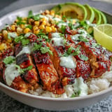 Juicy spiced chicken tops vibrant Street Corn Chicken Rice Bowls, perfect for dinner.