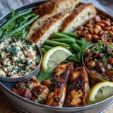 Artfully arranged Lemon Herb Tinned Fish board, a vibrant Mediterranean appetizer.