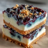 Delicious no-bake lemon blueberry cheesecake bars ready for a refreshing dessert.