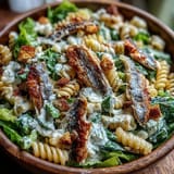 Freshly tossed Sardine Caesar Pasta Salad featuring tender pasta and savory fish.