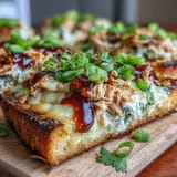 Delicious Chili Crisp Tuna Melt Flatbread baked to golden perfection with melted cheese.