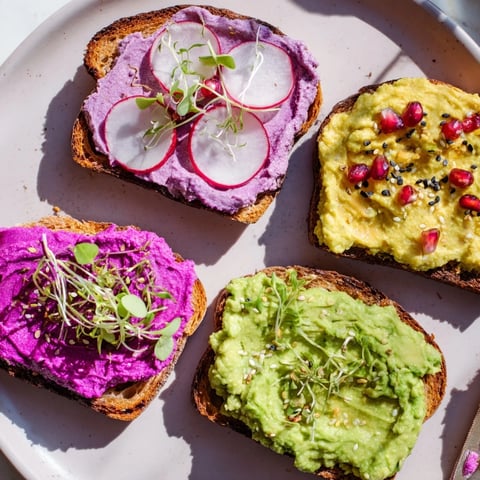 Vibrant Bright & Bold Breakfast Toasts topped with ube, avocado, and fresh garnishes.  