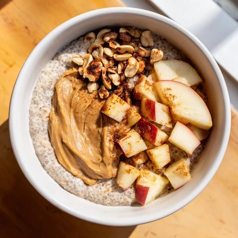 Apple-Chia Pudding with peanut butter showcasing creamy layers, apples, and a peanut butter swirl.