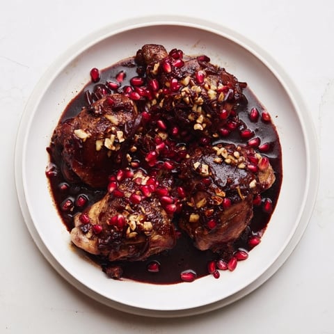 Golden-brown Budget Fesenjan Stew with Chicken Thighs, ready to be served over fluffy rice.