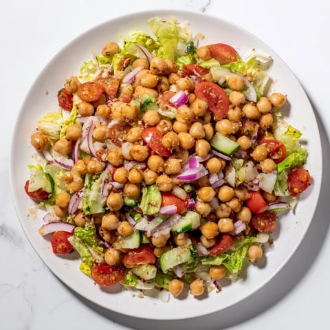 Fresh La Scala Chopped Chickpea Salad, a colorful mix of veggies and creamy chickpeas, ready to eat.