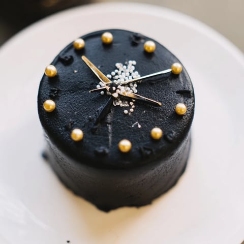 Festive Countdown Clock Mini Desserts; colorful buttercream frosting with edible pearls celebrate a special occasion.
