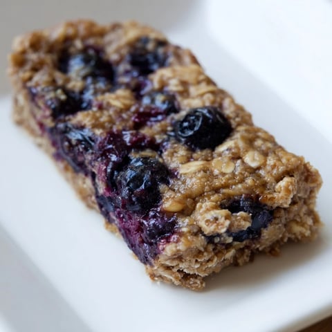 A tray of delicious Blueberry Banana Oatmeal Protein Bars, perfect for a quick breakfast.