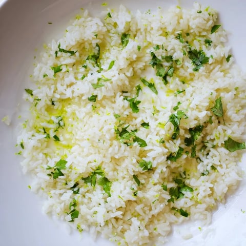Steaming bowl of Cilantro Lime Rice: fluffy, bright green, a zesty Mexican side dish.