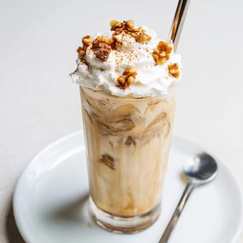 Refreshing Iced Banana Bread Latte recipe: blended banana, spices, and espresso over ice.