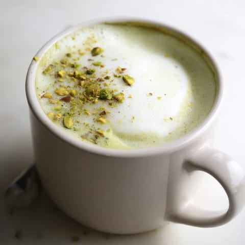 Homemade pistachio milk latte served hot, perfect for cozy mornings or afternoon breaks.  