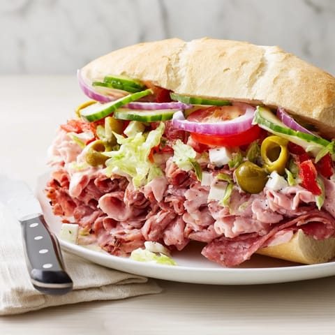 Delicious Flavor Mash-Up Sandwiches showcasing melted provolone and zesty pepperoncini peppers.  