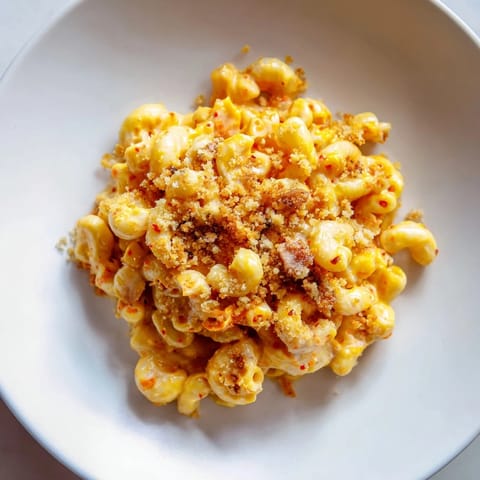 Savory Spicy Kimchi Mac & Cheese, a bold blend of cheeses and kimchi goodness.  