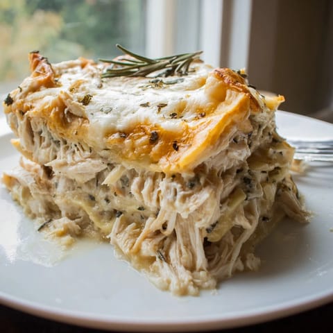 Golden, bubbling rosemary chicken lasagna fresh from the oven, ready to serve.  