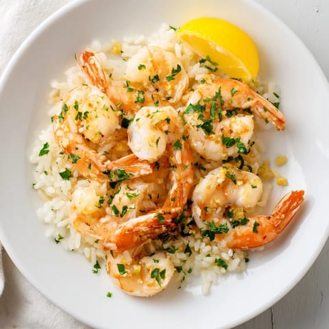Sizzling aroma: Garlic butter shrimp rice bowl featuring tender shrimp, perfect for dinner tonight.
