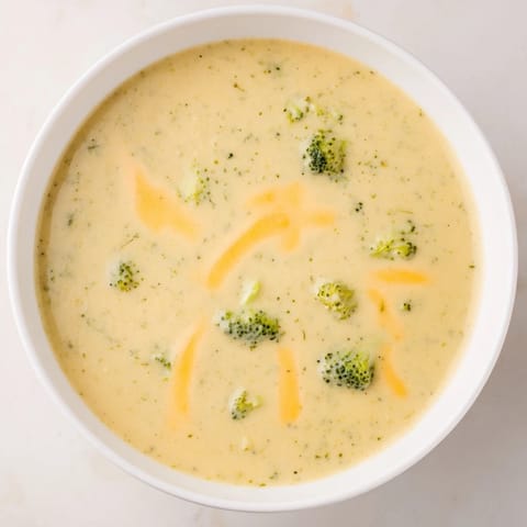 Creamy, homemade Broccoli Cheese Soup: full of tender broccoli florets and sharp cheddar flavor.