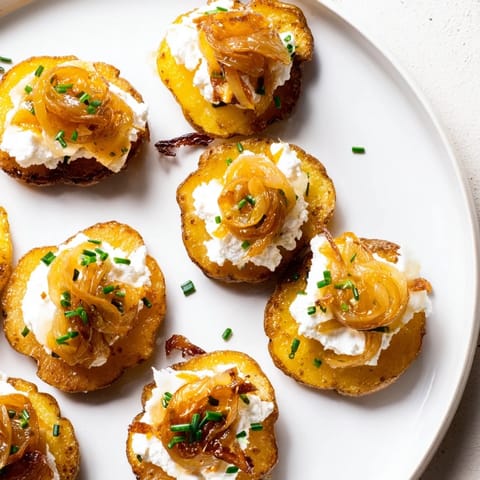 These vegetarian Lightened French Onion Potato Bites feature tender potato rounds with creamy cheese and flavorful onions.