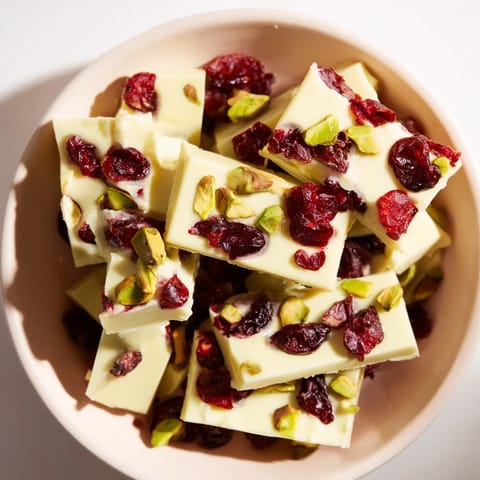 Sweet and creamy clusters of Matcha White Chocolate Cranberry Bark, ideal for a gluten-free dessert option.