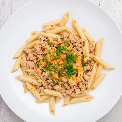 A close-up of the delicious Turkish Pasta with Ground Turkey showing the creamy yogurt and spiced meat.