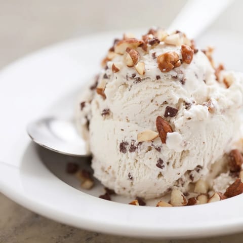 A close-up of fresh Cottage Cheese Ice Cream, looking lusciously thick and cold, perfect for a treat.