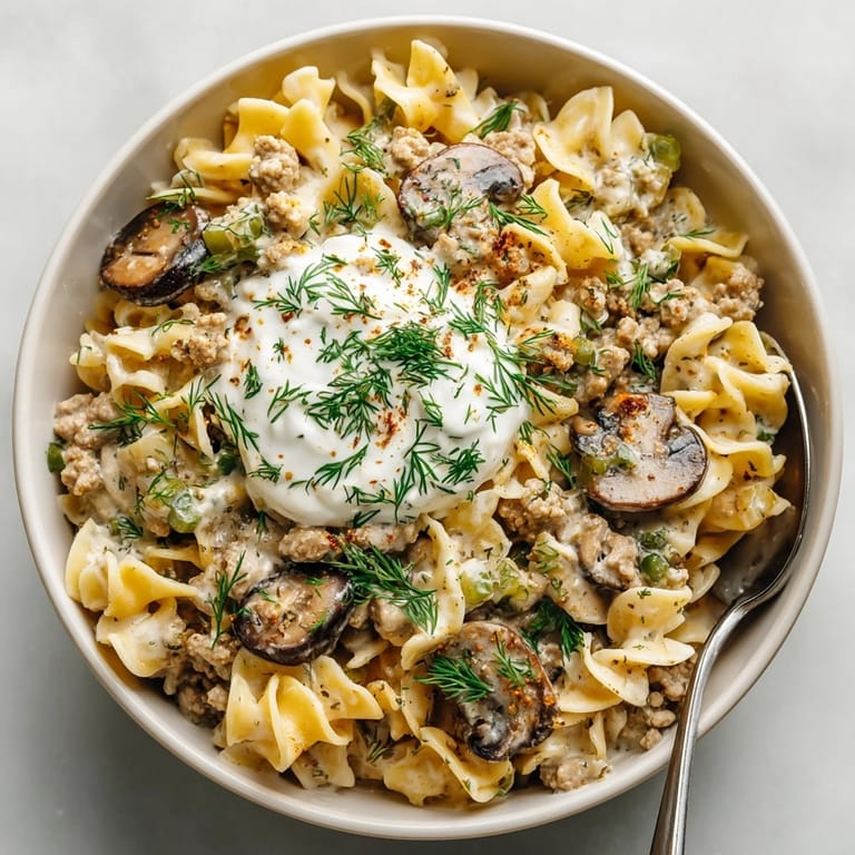 Hearty One-Pot Pickle-Fix Ranch Turkey Stroganoff bubbling in a skillet, offering a burst of ranch flavor.