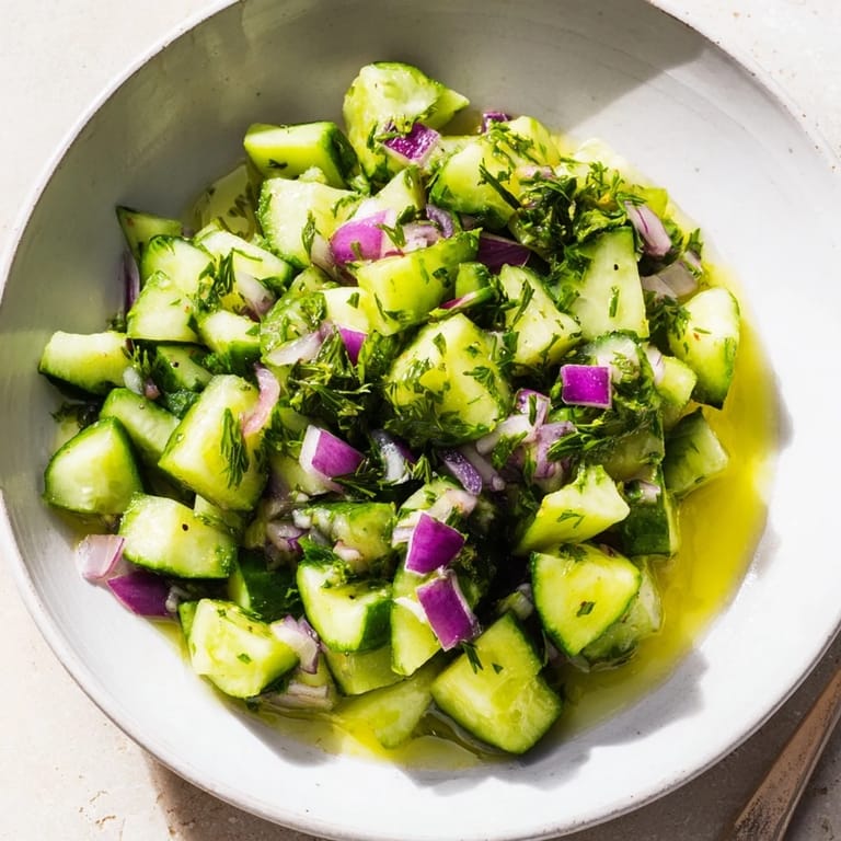 This Simple Cucumber and Dill Chopped Salad shows colorful vegetables tossed in a bright, zesty dressing.