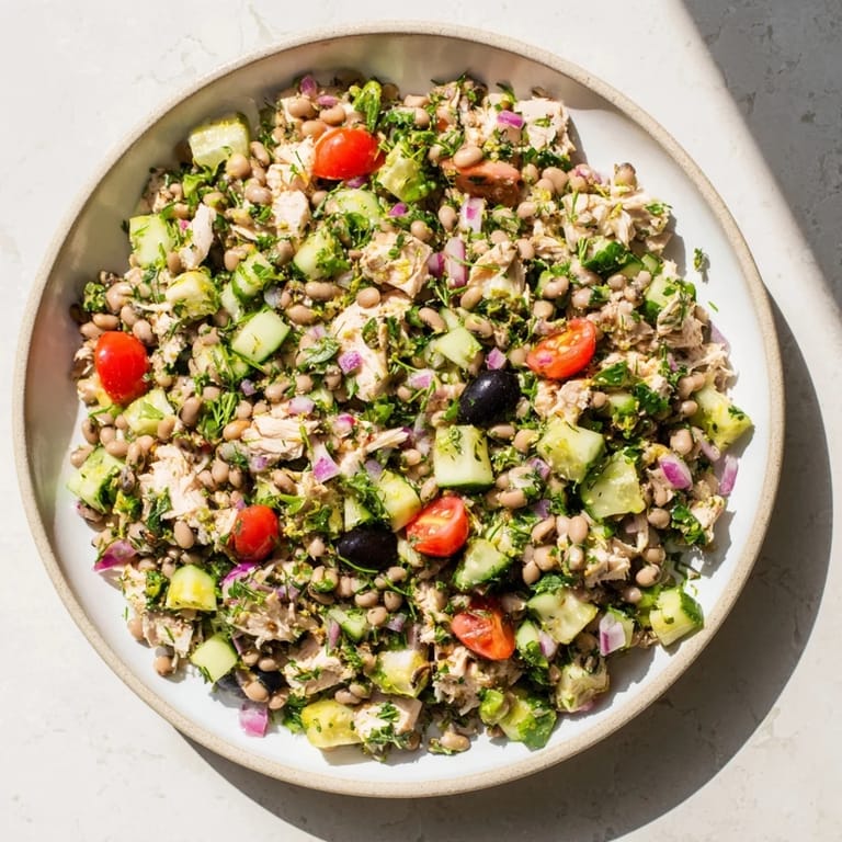 This close-up shows the hearty Dense Bean Salad with Lemon-Dill Chicken, perfect for a protein-packed meal.