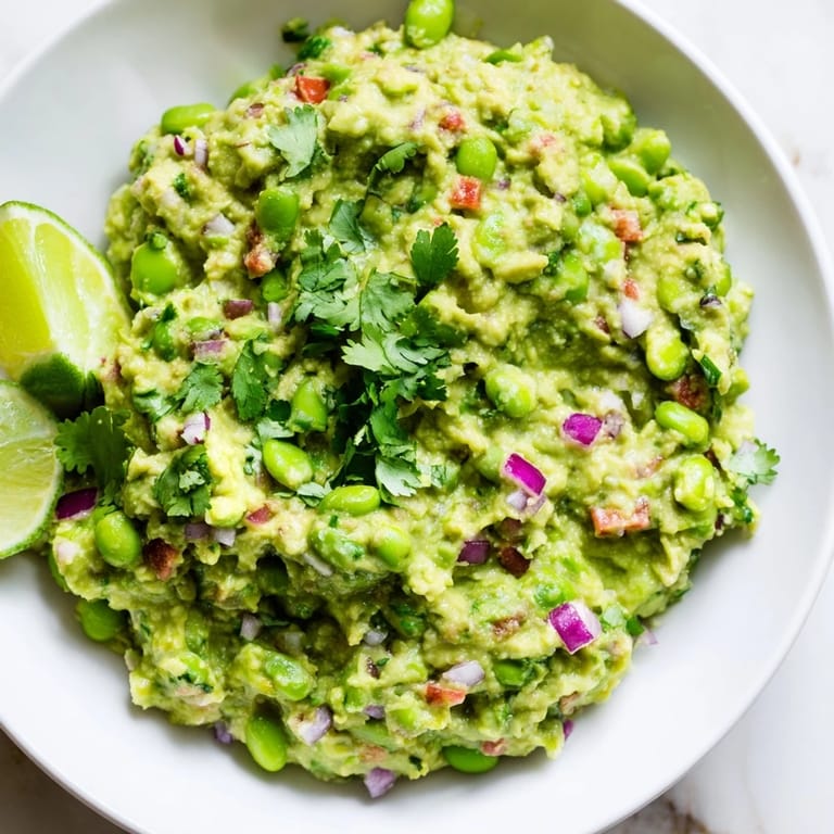 This delicious Edamame Guacamole features perfectly mashed avocado and bright green edamame.