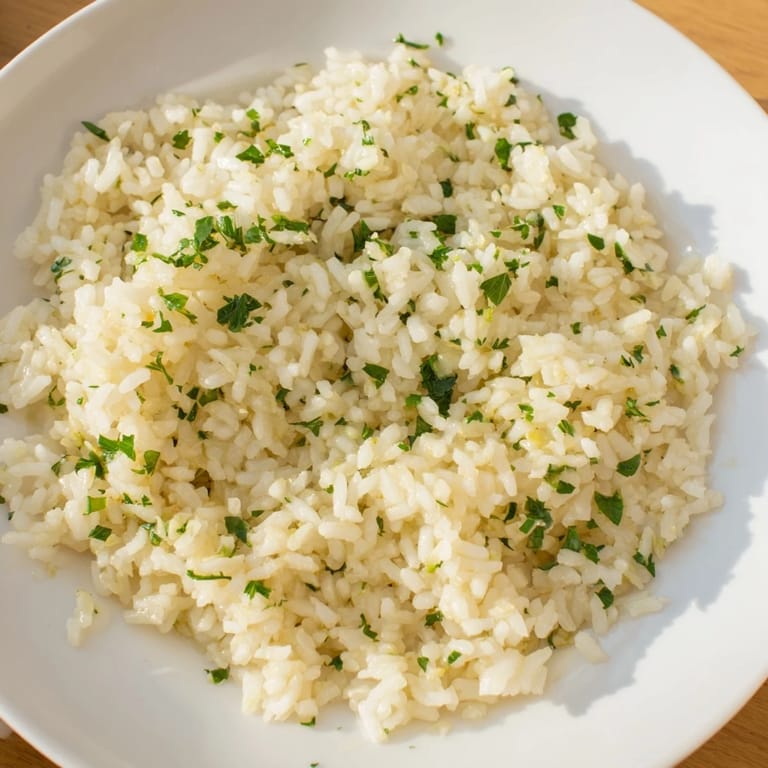 Creamy, flavorful Garlic Butter Rice, a simple and delicious side dish to complement your main course beautifully.